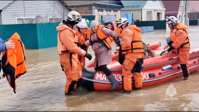 ORSK, RUSSIA - APRIL 6: (----EDITORIAL USE ONLY - MANDATORY CREDIT - 'RUSSIAN MINISTRY OF EMEGENCY SITUATIONS / HANDOUT' - NO MARKETING NO ADVERTISING CAMPAIGNS - DISTRIBUTED AS A SERVICE TO CLIENTS----) A screen grab captured from a video shows residents are being evacuated collectively due to flooding after a dam burst in the city of Orsk, Russia on April 6, 2024. In the statement made by the Orsk Municipality, a large area in the region was flooded as a result of a large breach in the dam on the Ural River passing through the city. More than 700 people were evacuated from the flooded area. (Photo by Russian Ministry of Emergency/Anadolu via Getty Images)