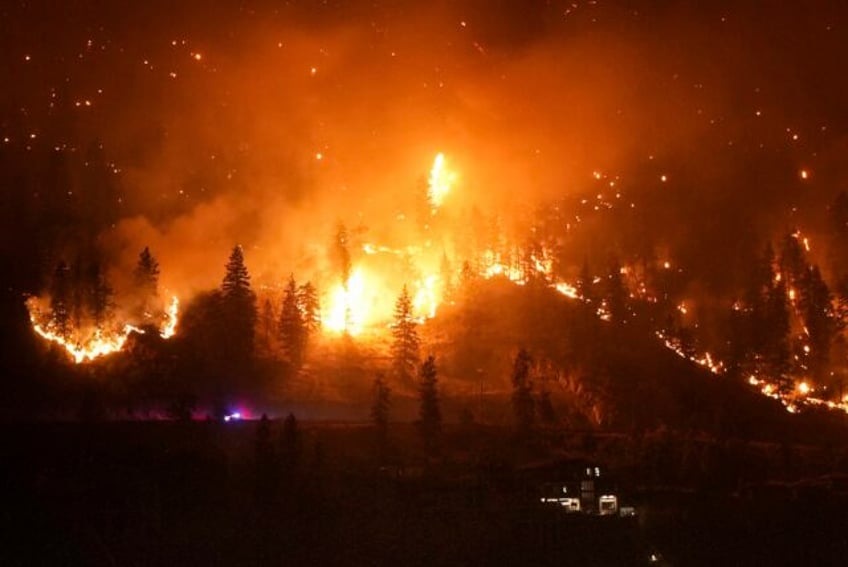 thousands flee raging wildfire turning capital of canadas northwest territories into ghost town