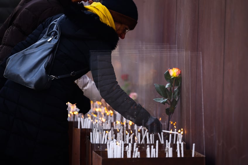 People light candles at Berlin Wall Memorial after the commemoration ceremony marking the 35th anniversary of the fall of the Berlin Wall. Berlin, Germany on 9 November, 2024. (Photo by Beata Zawrzel/NurPhoto via Getty Images)