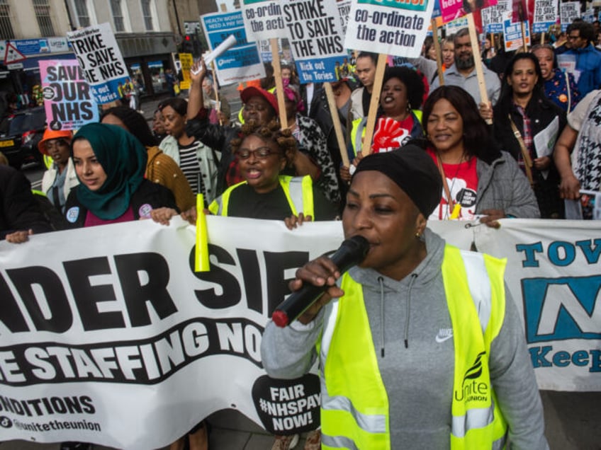 LONDON, ENGLAND - OCTOBER 4: Striking members of the BMA and UNIT trade unions march around Royal London Hospital on October 4, 2023 in London, England. Junior Doctors and Consultants continue joint strikes for better pay and conditions. (Photo by Guy Smallman/Getty Images)