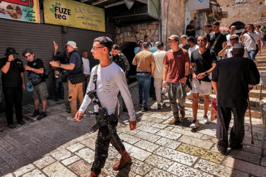 Israeli right-wing activists attend a march commemorating Jerusalem Day