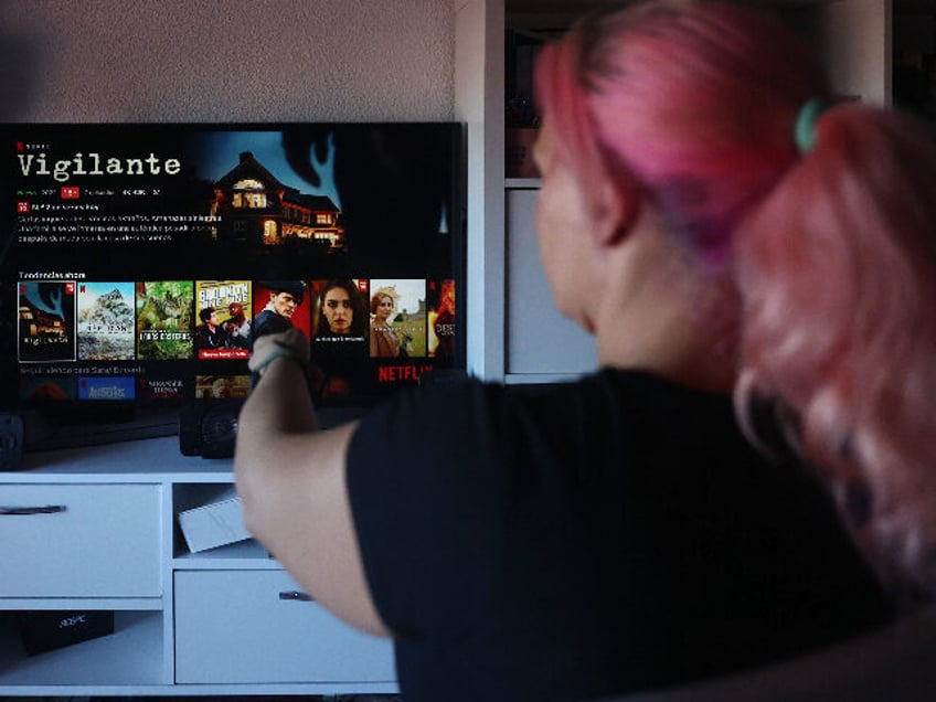 MADRID, SPAIN - OCTOBER 14: A user connects to the Netflix platform on October 14, 2022, in Madrid, Spain. The U.S. entertainment company and streaming platform has decided to activate its first plan with advertising in November, which will be available in 12 countries. Depending on the country, between 5% …