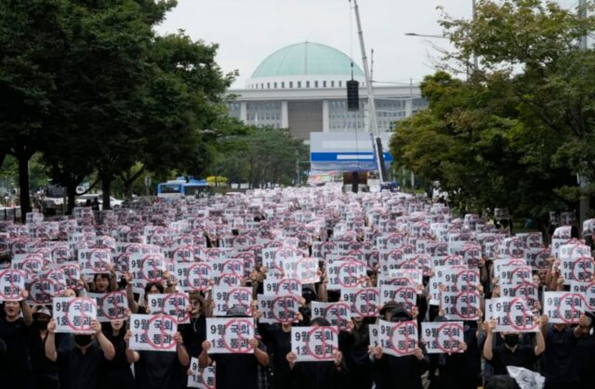 thousands of south korean teachers are rallying for new laws to protect them from abusive parents