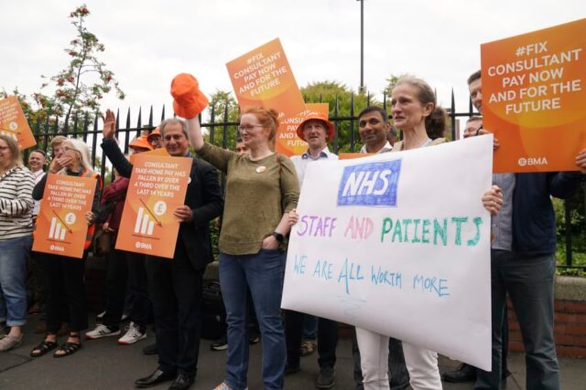 thousands of uk hospital doctors walk out in latest pay dispute crippling health services