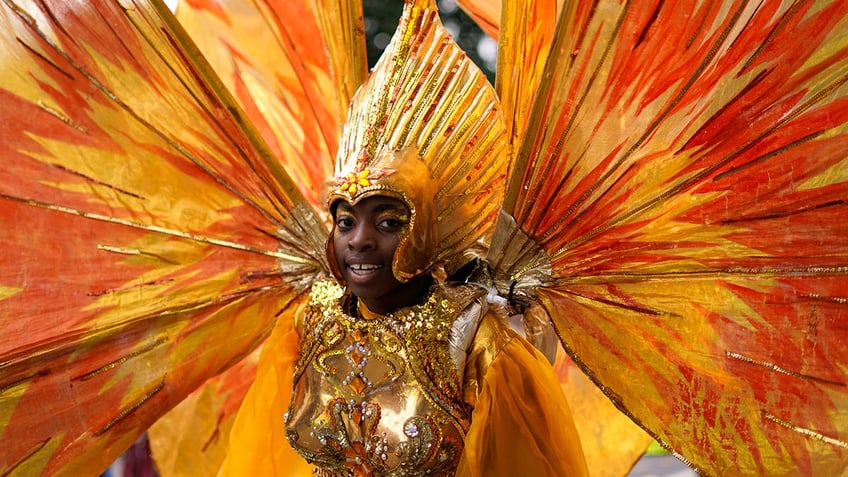 thousands pack streets of london to celebrate notting hill carnival one of europes largest street parties