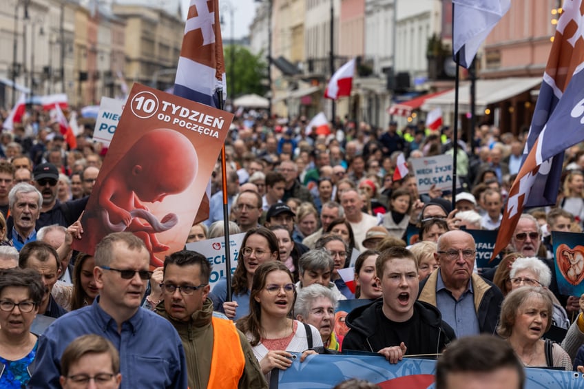 People take part in the March of Life - a demonstration by pro-life organizations against the liberalization of abortion rights, in Warsaw, on April 14, 2024. (Photo by Wojtek Radwanski / AFP) (Photo by WOJTEK RADWANSKI/AFP via Getty Images)