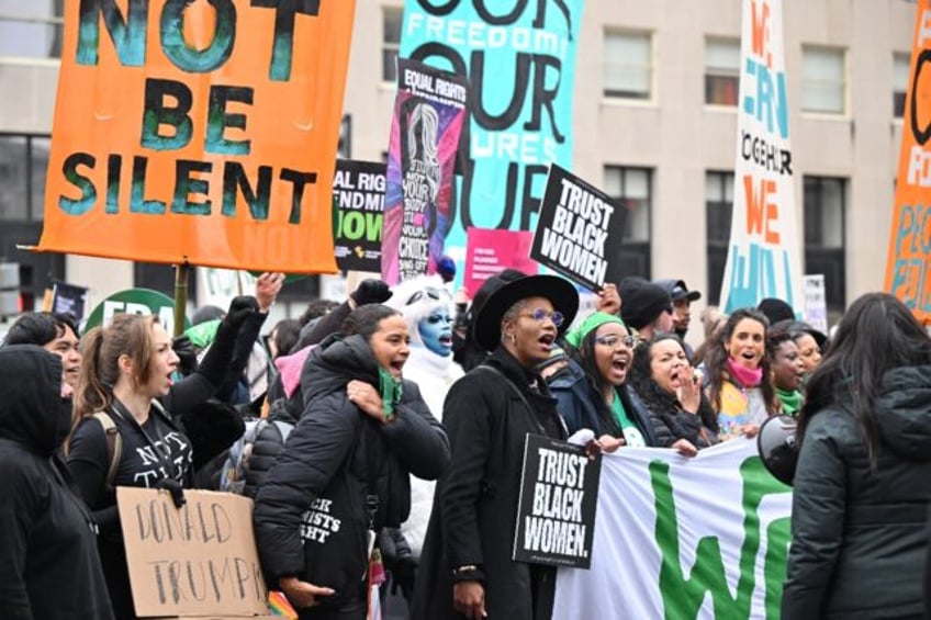 Protesters rally against US President-elect Donald Trump and his policies at the 'People's