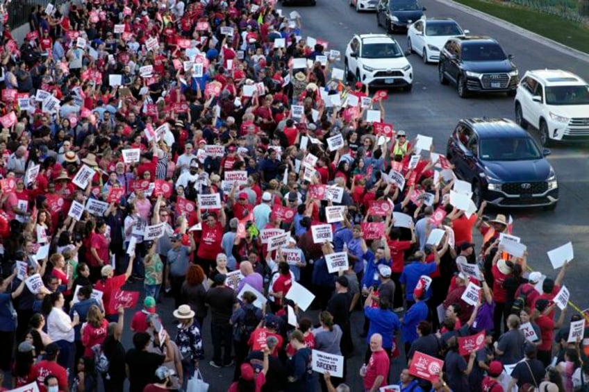 thousands rally on las vegas strip in support of food service workers demanding better pay benefits