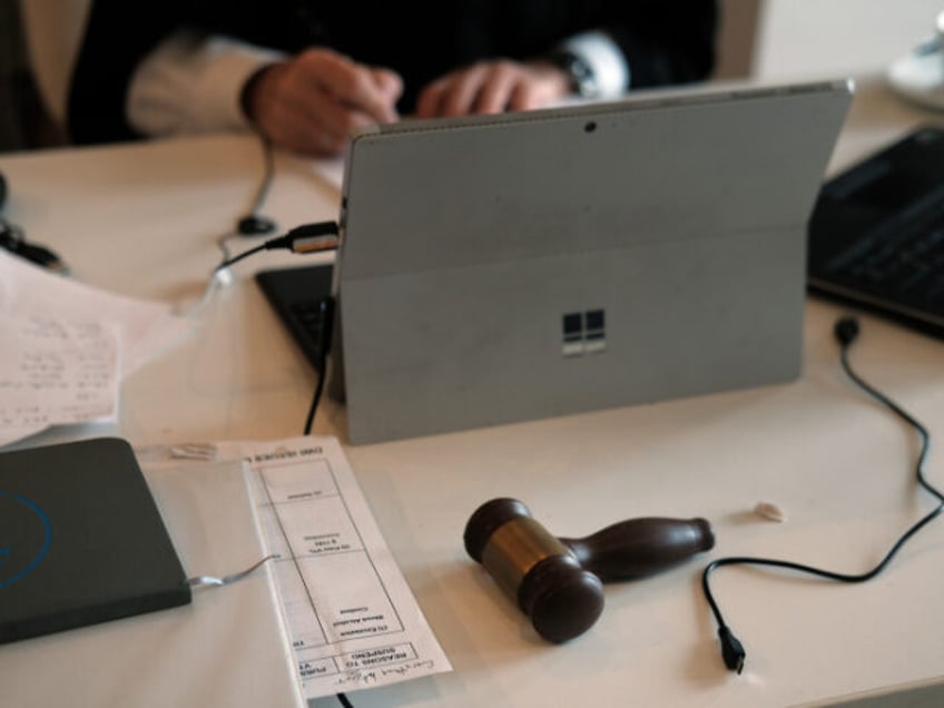 A gavel sits on the table as New York City Criminal Court Judge Paul McDonnell works remot