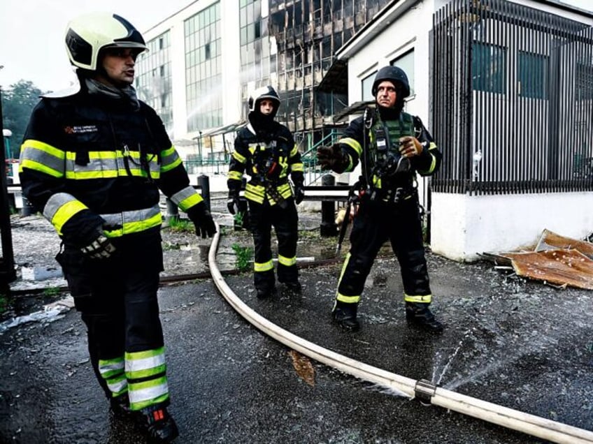 KYIV, UKRAINE - JUNE 10: Firefighters work at the site after a Russian missile and drone a