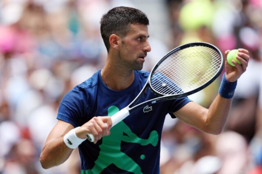 Defending champion Novak Djokovic of Serbia practices before the US Open tennis championsh