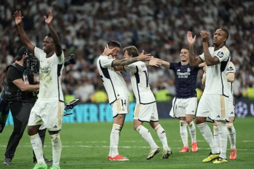 Joselu (C) celebrates with team-mates after his goals in the 88th and 91st minutes gave Re