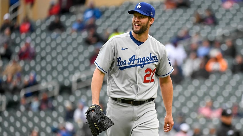 Clayton Kershaw walks to the dugout