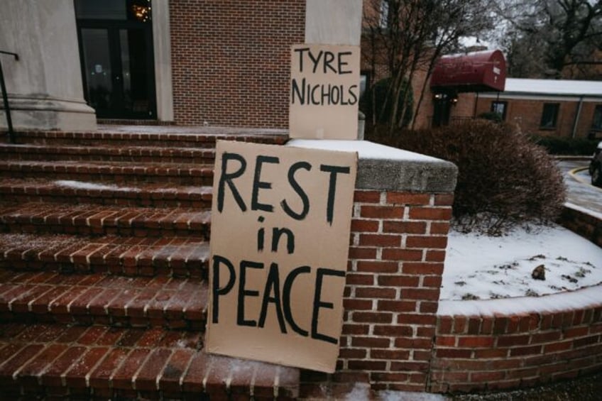 Signs are placed on the steps of a church in Memphis, Tennessee on the morning of Tyre Nic