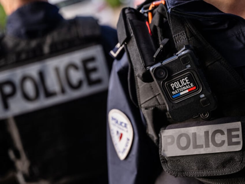 This photograph taken on October 21, 2022, shows a detail of a French police officer's sig