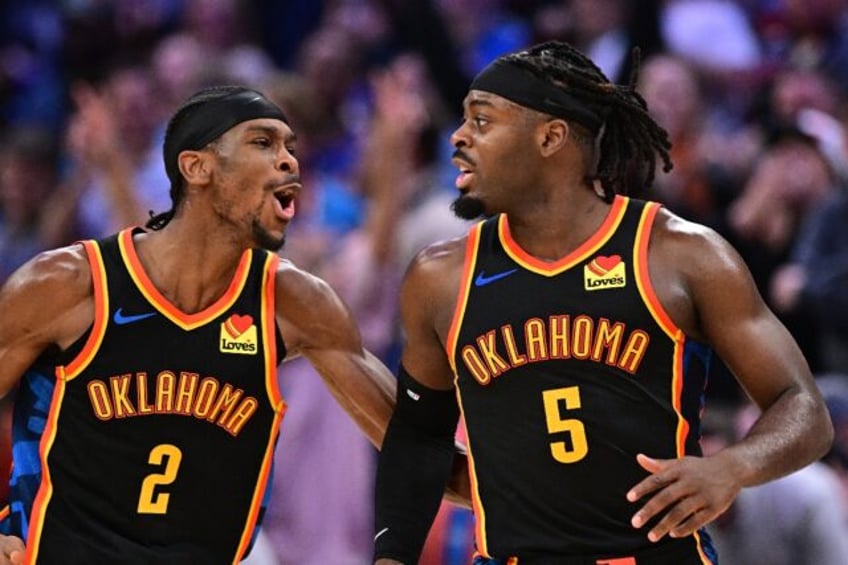 Shai Gilgeous-Alexander, left, and Luguentz Dort, right, of Oklahoma City celebrate during