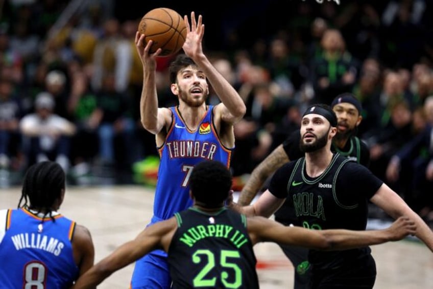 Oklahoma City's Chet Holmgren shoots over New Orleans' Trey Murphy III as the Thunder comp