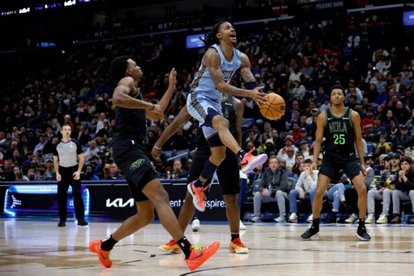 Memphis star Ja Morant shoots over Herbert Jones of the New Orleans Pelicans in the Grizzlies' NBA victory