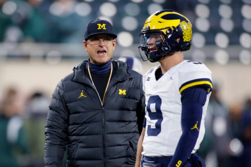 ticket buys to multiple big ten games found in name of suspended michigan staffer ap sources say