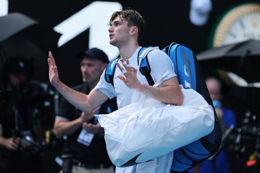 Britain's Jack Draper gestures as he retires from his match