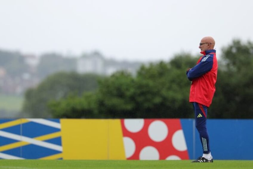 Spain's head coach Luis de la Fuente supervises his team's training session on Thursday