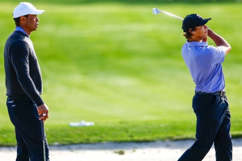 Tiger Woods, left, watches son Charlie practice ahead of the weekend's 36-hole PNC Champio