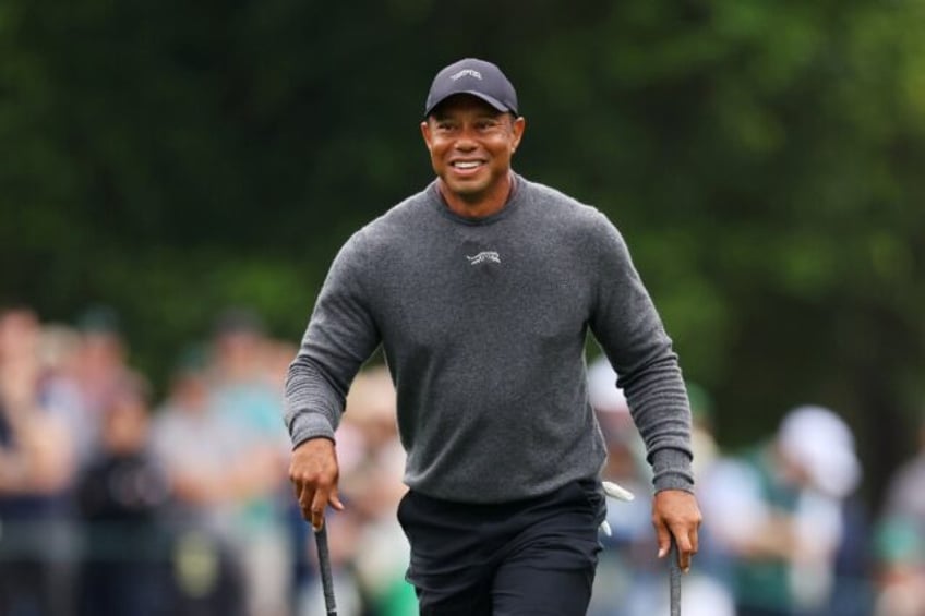 Tiger Woods reacts on the eighth hole during a practice round prior to the 88th Masters