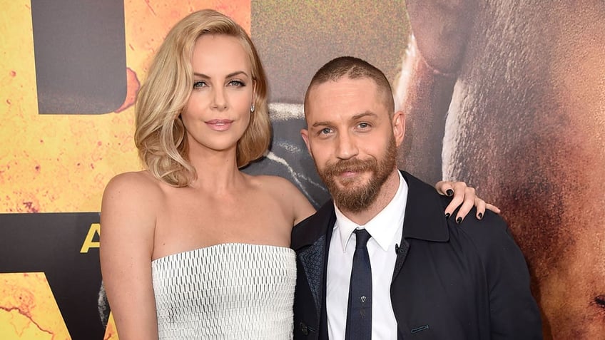 Charlize Theron and Tom Hardy on red carpet