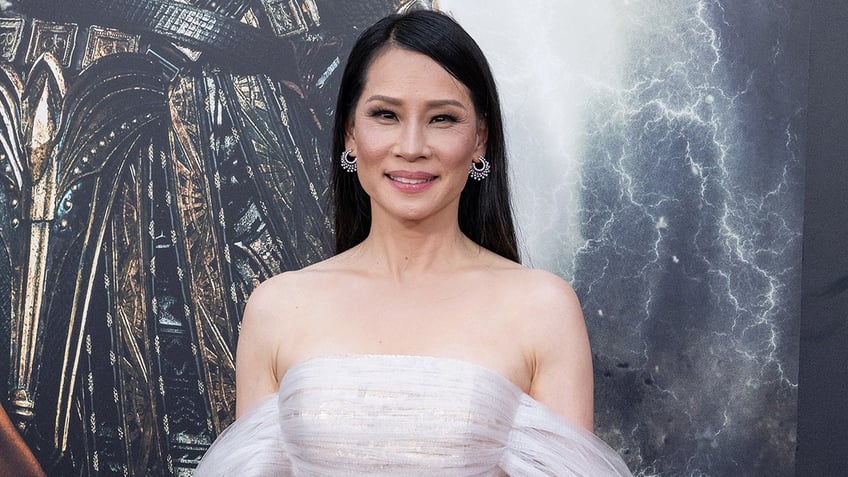 Lucy Liu walks the red carpet at a movie premiere