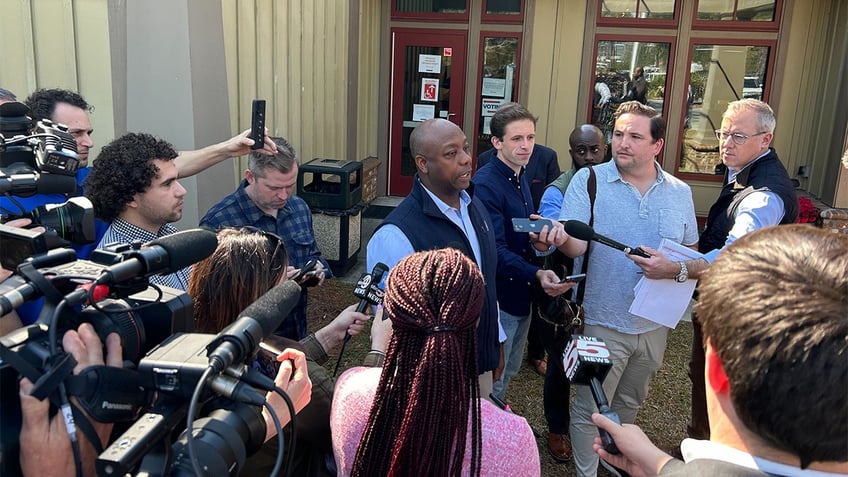 Tim Scott talking with reporters