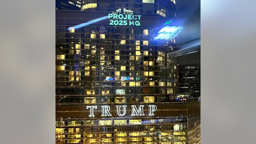 The Democratic National Committee projects images on Trump Tower in Chicago, on the eve of the Democrats' national convention, on August 18, 2024