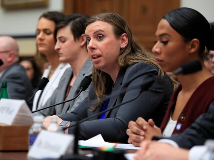 Army Staff Sgt. Patricia King, second from right, together with other transgender military