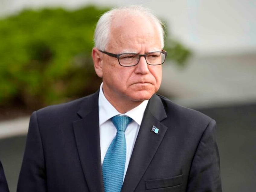 FILE - Minnesota Gov. Tim Walz listens after meeting with President Joe Biden, July 3, 202