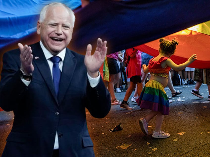 A girl plays under a giant LGTBI flag, during the great pride demonstration that took plac