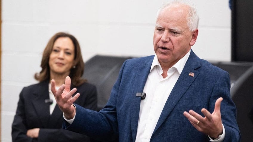 Gov. Tim Walz with VP Kamala Harris behind him to his right