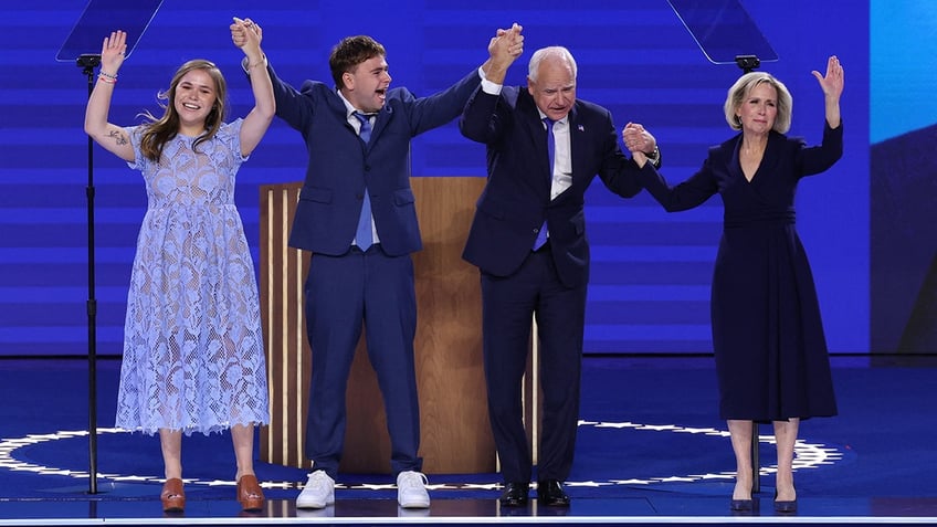 U.S. Democratic vice presidential nominee Minnesota Governor Tim Walz, his wife Gwen Walz and son and daughter Gus and Hope stand onstage on Day 3 of the Democratic National Convention