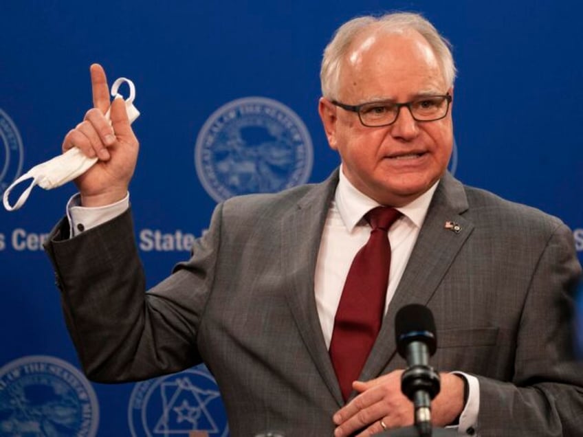 FILE - In an April 30, 2020 file photo, Minnesota Gov. Tim Walz answers questions while ho