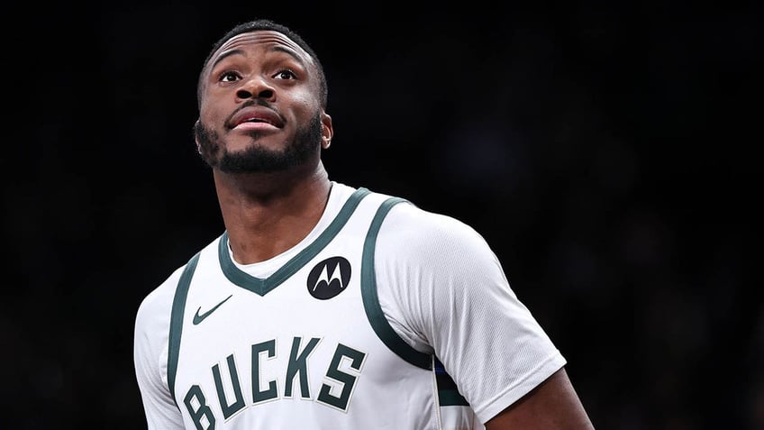 Thanasis Antetokounmpo looks on during a game