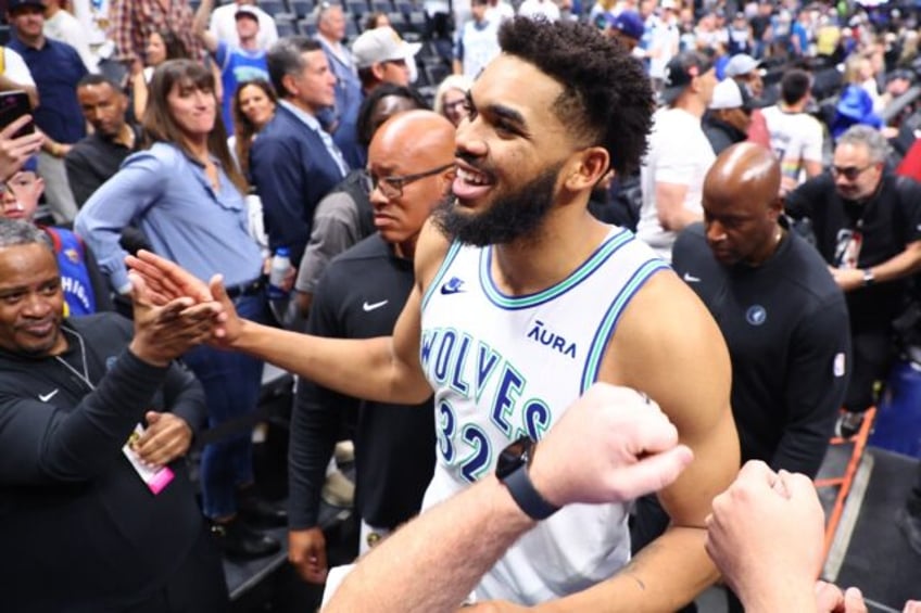 Minnesota's Karl-Anthony Towns celebrates after the Timberwolves' series-clinching victory