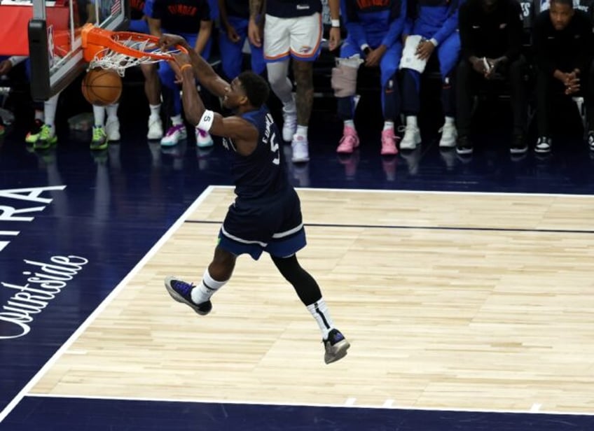 Minnesota's Anthony Edwards slam dunks the ball in an NBA playoff rout of the Oklahoma Cit
