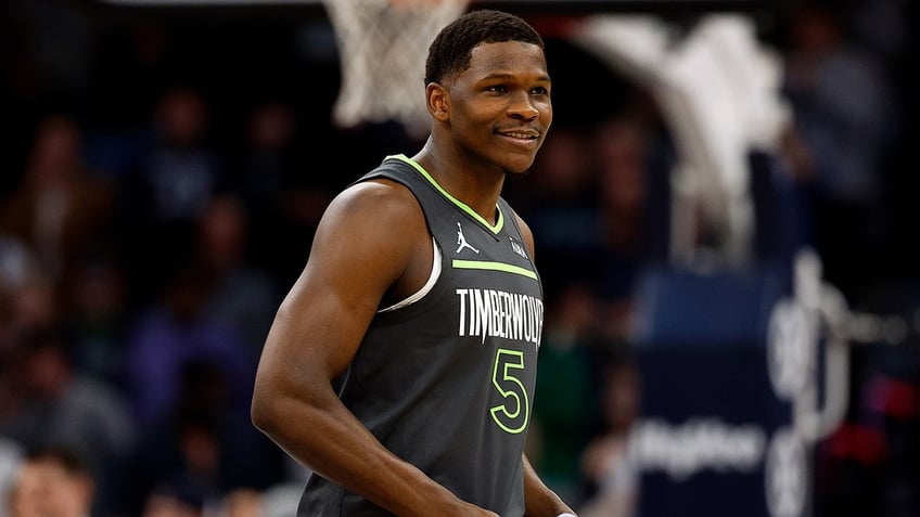 Anthony Edwards smiles before a game against the Kings