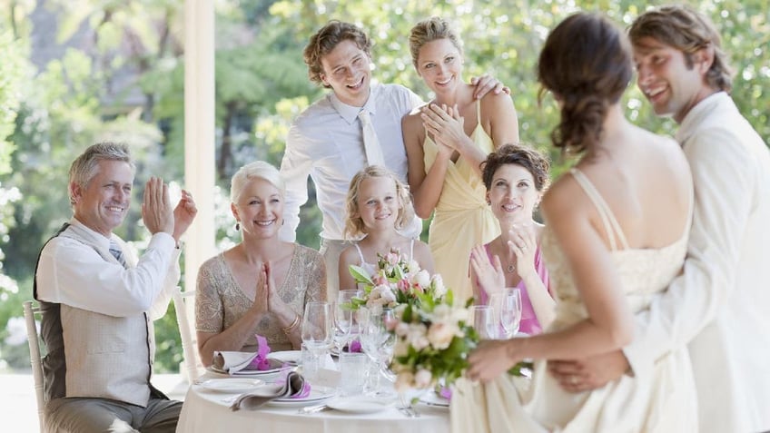 Family celebrating at wedding reception