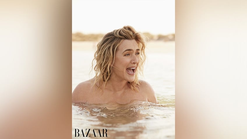 Kate Winslet laughing in a lake