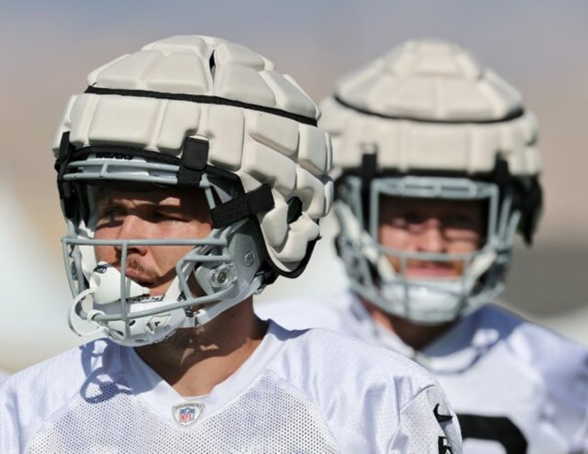 NFL tight ends Jesper Horsted, left, and Nick Bowers, right, of the Las Vegas Raiders wear