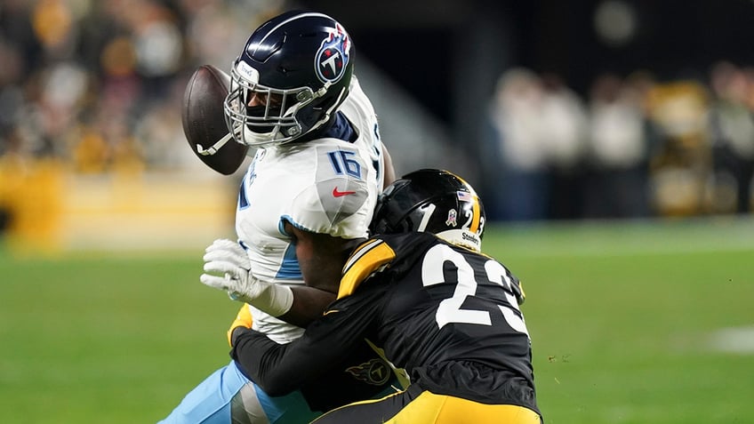 titans treylon burks carted off field after hitting head on field laying motionless