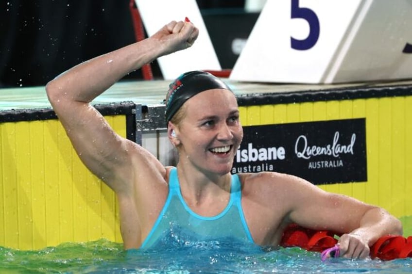 Australia's Ariarne Titmus reacts after breaking the women’s 200m freestyle world record