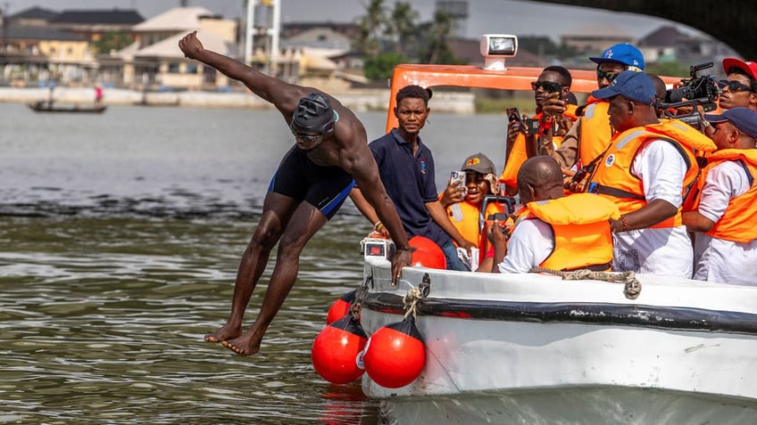 Akinrodoye Samuel jumps into the water