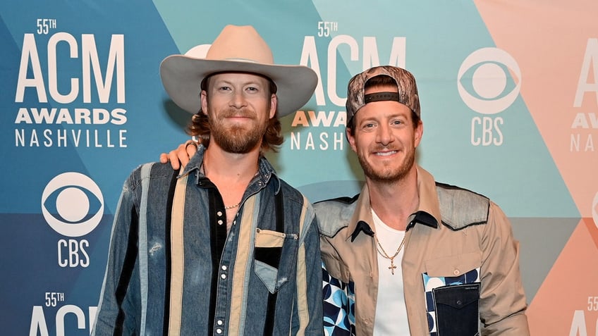 Brian Kelley and Tyler Hubbard of Florida Georgia posing together