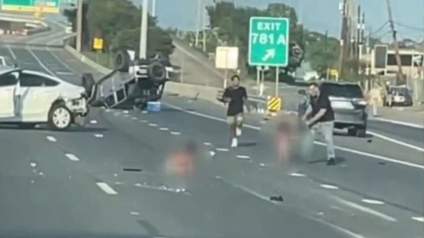 A father runs towards his kids dressed in diapers after a crash