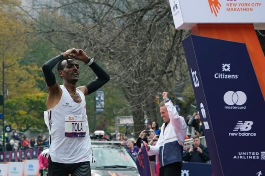 tola powers to new york marathon win obiri pips gidey